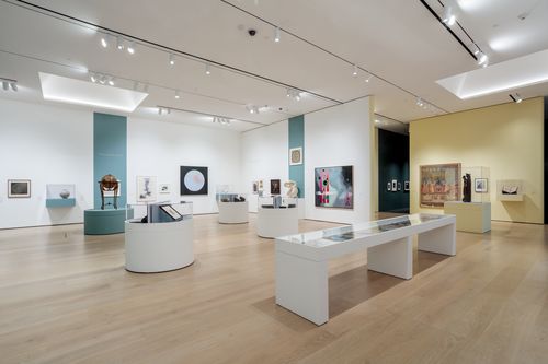 View of a gallery with artworks in a variety of media