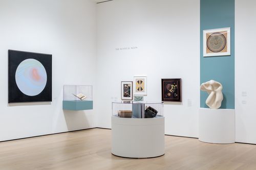 View of a gallery with artworks in a variety of media