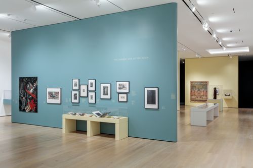 View of a gallery with artworks in a variety of media