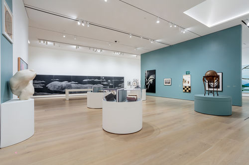 View of a gallery with artworks in a variety of media