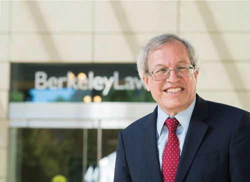 Color photo portrait of Erwin Chemerinsky in front of UC Berkeley Law School