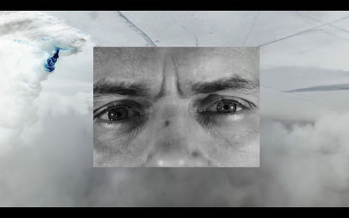 Black and white close up of a face, inset over an image of clouds