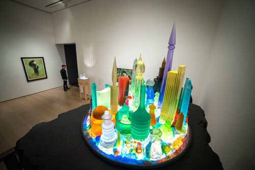 Sculptural installation of glowing, colorful, futuristic cityscape based on Kandor from the Superman comics
