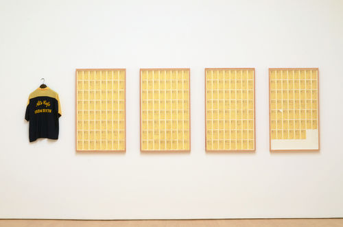 Framed receipts and an embroidered blue shirt from Al's Cafe