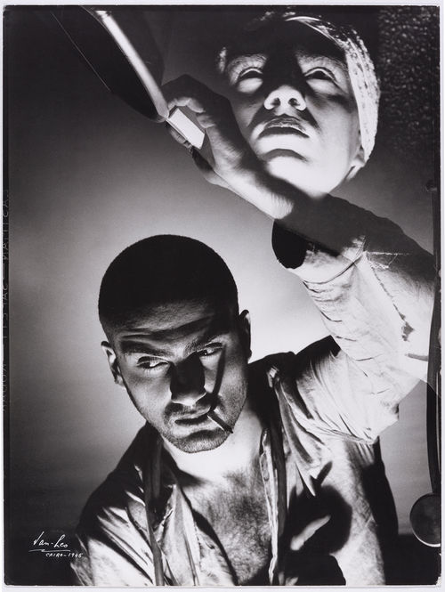 Dramatic photo of Van Leo smoking a cigarette