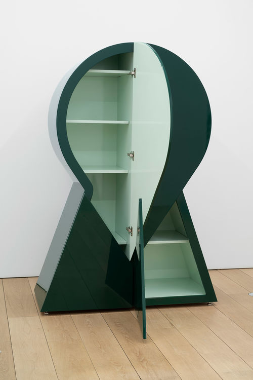 A green, keyhole-shaped cabinet