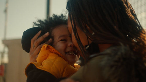 A mother and baby embrace