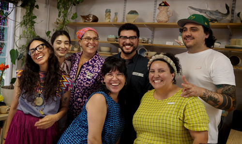 Photo of seven artists in a studio