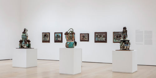 View of a gallery filled with sculptures