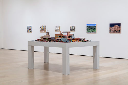 View of a gallery with a city block recreated in miniature in ceramic
