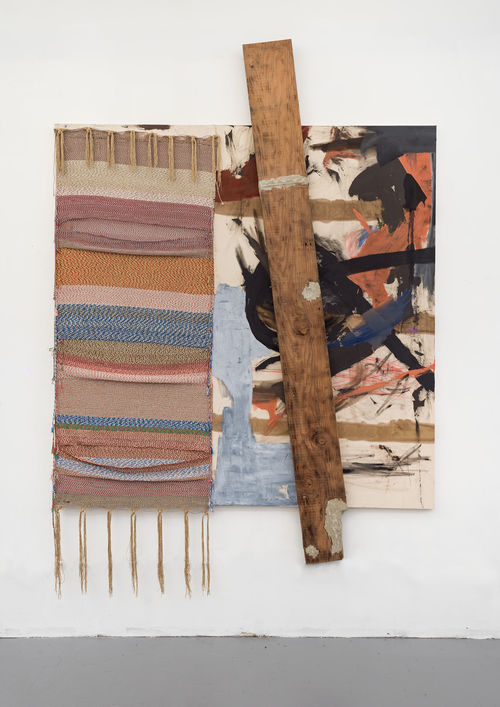 Mixed-media assemblage hanging on the wall