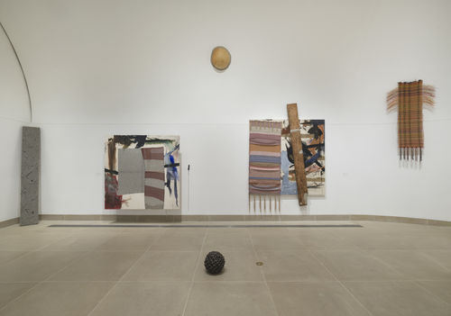 Installation image of multimedia paintings and sculptures installed in vault gallery