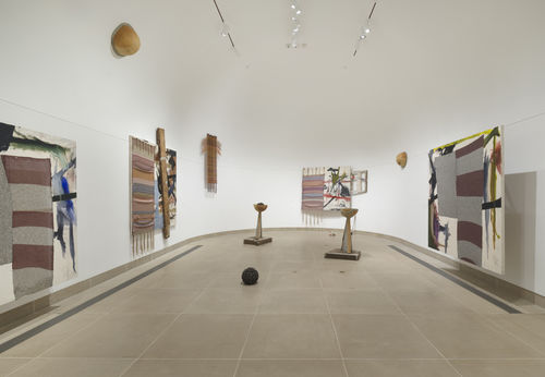 Installation image of multimedia paintings and sculptures installed in vault gallery