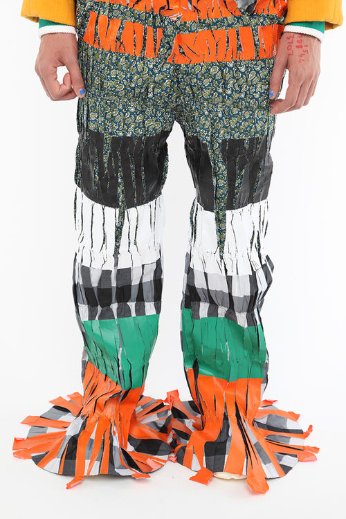 Pair of bright, multi-colored pants, ending in wide bell bottoms