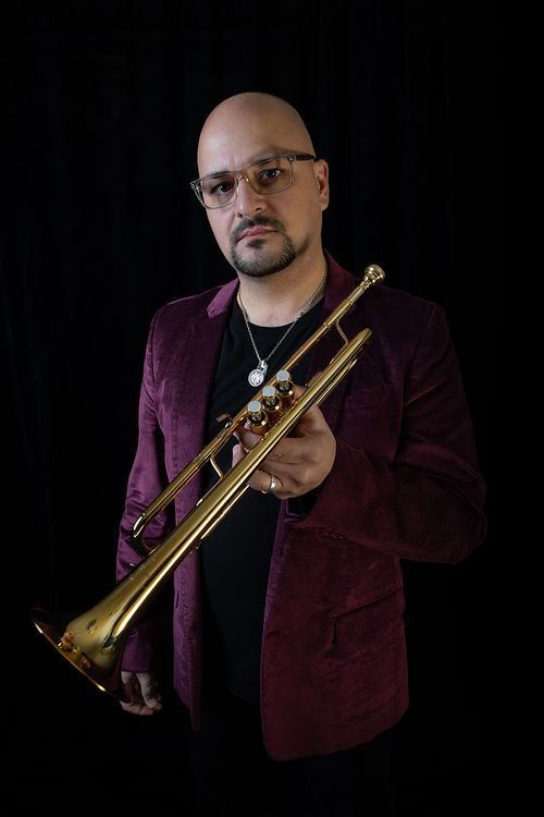 Dan Rosenboom holding a trumpet