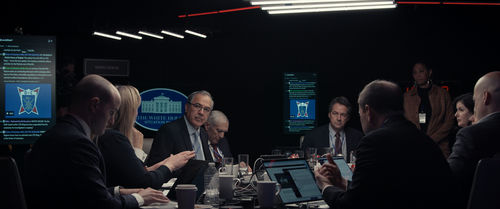 The President and his senior advisors sit in the war room