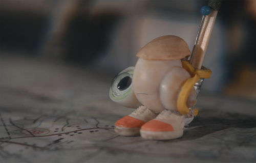 An anthropomorphized shell wearing a homemade backpack