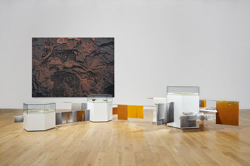 Tapestry and sculptural works in a gallery