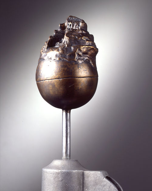 Sculpted bronze orb crowned by a depiction of the Tower of Babel