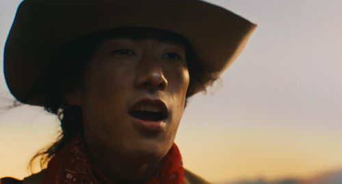 Close up of a man in a cowboy hat