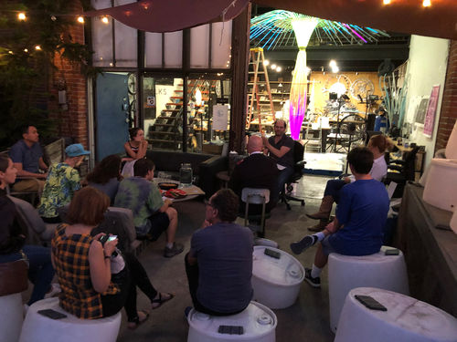 A group of people in an artist's studio