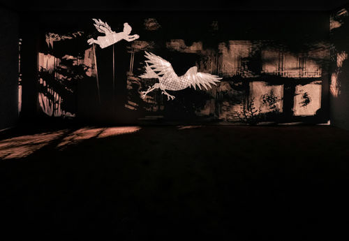 Image of multimedia installation with elements of shadow puppetry