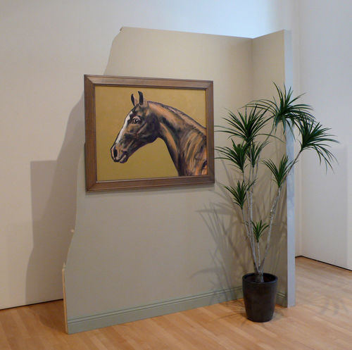 Installation featuring a partial wall with a painting of a horse and a potted plant on the floor