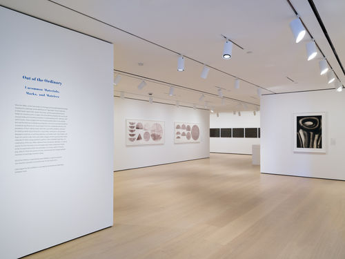 Installation view of framed works installed on wall