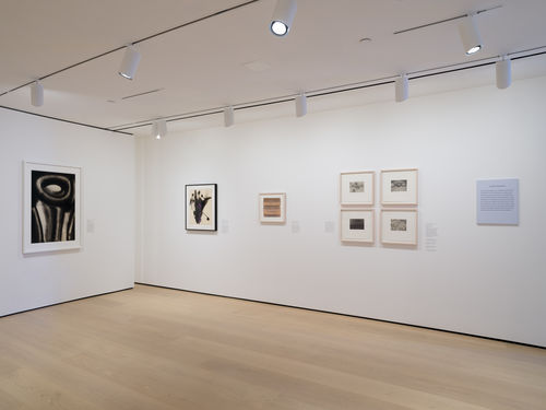 Installation view of framed works installed on wall