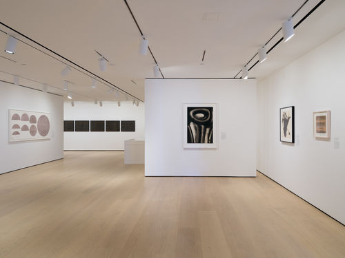 Installation view of framed works installed on wall