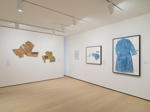 installation image of framed works on wall