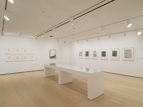 Installation view of framed works installed on wall