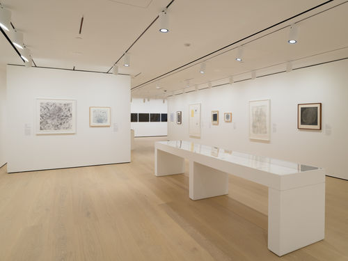 Installation view of framed works installed on wall