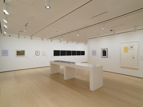 Installation view of framed works installed on wall