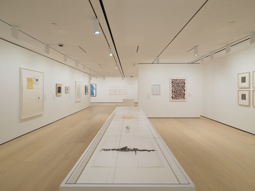 Installation view of framed works installed on wall