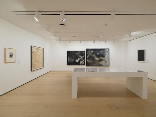 Installation view of framed works installed on wall