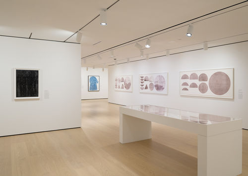 Installation view of framed works installed on wall