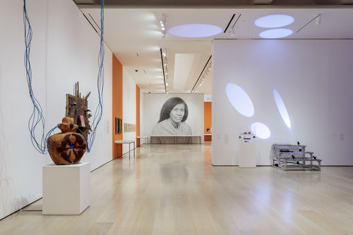 Installation view of a gallery with a large-scale photograph of Alice Coltrane