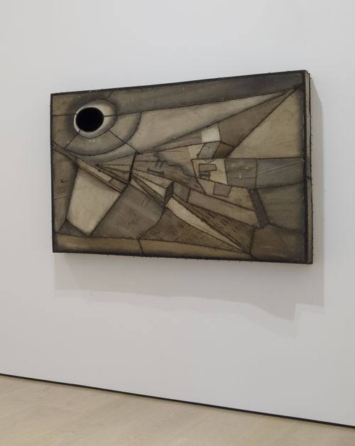 an abstract painting hang on the white wall