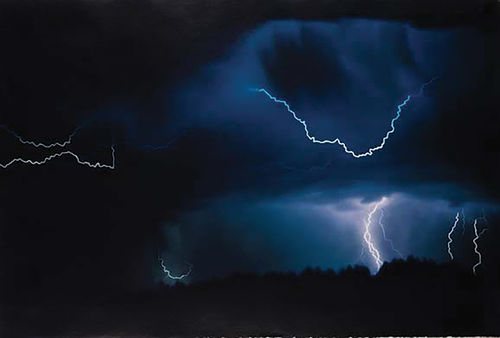 Lightning striking in the dark sky