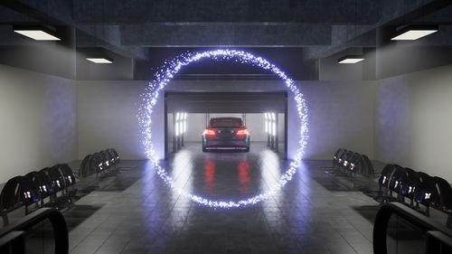 Animated still of a futuristic car driving through a ring of purple light