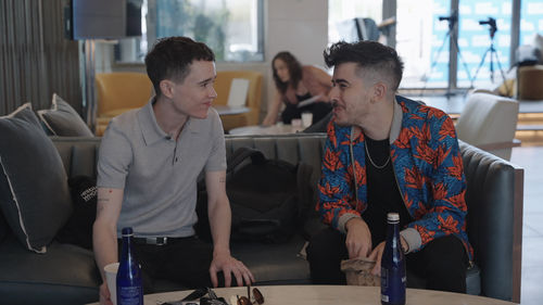 Chase Strangio and Elliot Page smile at each other