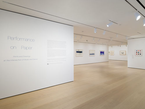 Gallery with framed works on paper on the wall