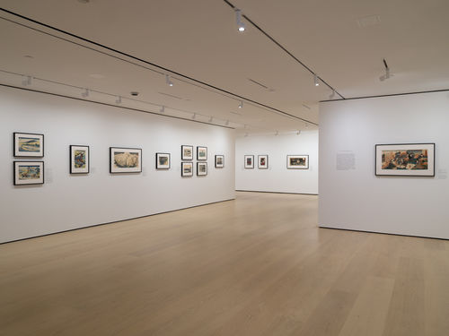 Gallery with framed works on paper installed on walls