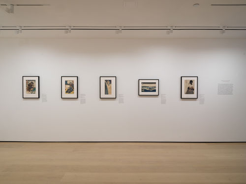 Gallery with framed works on paper installed on walls