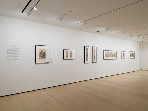 Gallery with framed works on paper installed on walls