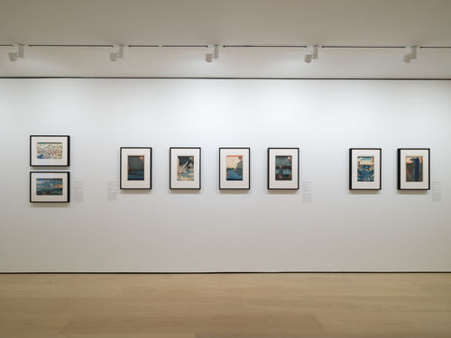 Gallery with framed works on paper installed on walls