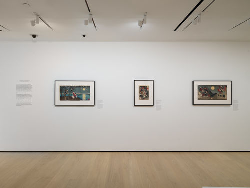 Gallery with framed works on paper installed on walls