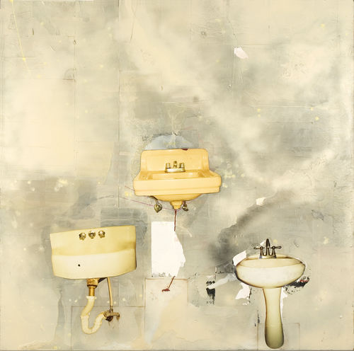 Three dingy sinks arranged in a triangle on a gray wall