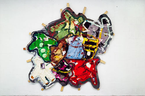 Oddly shaped painting covered with kids Halloween costumes